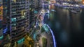 Waterfront Promenade With Palms In Dubai Marina Aerial Night Timelapse.