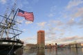 Waterfront view of Baltimore Inner Harbor marina and the city skyline with USS Constelation historic boat on the foreground