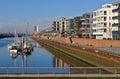 Waterfront of the Europa harbor in Bremen, Germany with moored sailing yachts and modern office and luxury apartment buildings Royalty Free Stock Photo