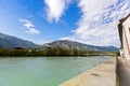 Waterfront view of Inn river along Inn promenade with mountain,