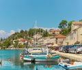 Waterfront view of a tiny village of Bobovisca on the island of brac. Crystal clear teal and green water reflection the bright sky