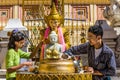 Watering buddha statue Shwedagon Pagoda Yangon Myanmar