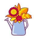 Watering can with autumn flowers and leaves.