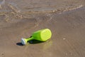Watering can for children on the sandy beach Royalty Free Stock Photo