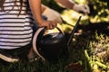 Watering can in hand of little girl working in garden Royalty Free Stock Photo