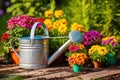 watering can near freshly planted flowers