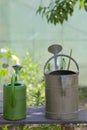 Watering cans on a table Royalty Free Stock Photo