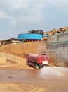 watering of dusty roads carried out by tank car operators