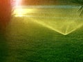 Watering fountain in ray sun