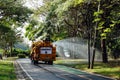 Watering the lawn on road by water tanker truck at Somdet-yah park