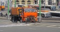 Watering machine orange color washes the streets of Moscow Royalty Free Stock Photo