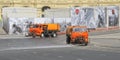 Watering machine orange color washes the streets of Moscow Royalty Free Stock Photo