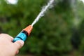 Watering plants in the garden during a summer drought