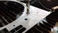 CNC Waterjet cuts stainless steel sheet - closeup