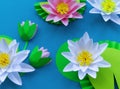 Waterlily flower made of paper. Blue background. Origami hobby. Gentle petal Royalty Free Stock Photo