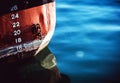 Waterline of a sea vessel. Early morning, calm sea. White jellyfish.