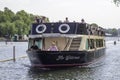 The Waterman River Cruiser and passengers on the Thames at Henley-on-Tha