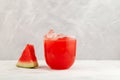 Watermelon agua fresca. Glass of Refreshing summer drink. Red punch with fresh watermelon juice. Fruit smoothie. Grey background, Royalty Free Stock Photo