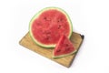 Watermelon on a bamboo cutting board isolated on a white background