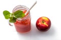 Watermelon cocktail in a jar with mint leaves, Apple on a saucer and a cocktail straw on a white background. Royalty Free Stock Photo