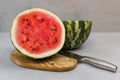 Fresh watermelon cut with knife. Watermelon cut half in two pieces Royalty Free Stock Photo