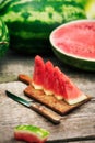 Watermelon cuts on chopping board