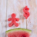 Watermelon in dollar form and man. Slice of watermelon with money and people