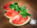 Watermelon drink watermelon pieces in a rustic wooden background. Royalty Free Stock Photo