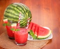 Watermelon drinks in glasses with slices of watermelon
