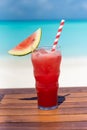 Watermelon float drink with straw on the wooden table ocean background at the beach Royalty Free Stock Photo