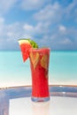 Watermelon fresh juice with mint on the glass table ocean background at the beach Royalty Free Stock Photo