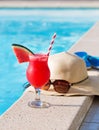 Watermelon fresh juice smoothie drink cocktail slippers, hat, sunglasses pool Royalty Free Stock Photo