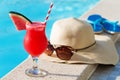 Watermelon fresh juice smoothie drink cocktail slippers, hat, sunglasses pool Royalty Free Stock Photo