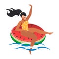 A beautiful and happy young woman on an inflatable watermelon floats on the sea waves