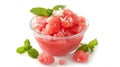 Watermelon granita in a glass bowl garnished with mint leaves, on a white background