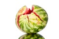 Watermelon with cracks on white mirror background with reflection isolated close up Royalty Free Stock Photo