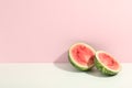 Watermelon halves on two tone background, space for text Royalty Free Stock Photo