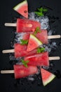 Watermelon ice cream on black wooden table