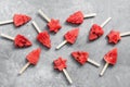 Watermelon ice cream in the shape of a Christmas tree. Summer fruit dessert on a stick. Top view, flat lay