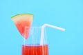 Watermelon juice summer with piece watermelon fruit on glass on blue background