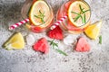 Watermelon lemon lemonade with pieces of watermelon in shape of heart. Refreshing summer drink concept Royalty Free Stock Photo