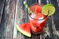 Watermelon lime water on rustic wood background