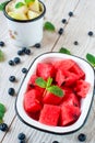 Watermelon and melon cubes, blueberry and mint leaves Royalty Free Stock Photo