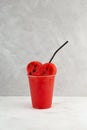 Watermelon Melon smoothie in disposable take away plastic cup. Cocktail with fresh watermelon pulp. Seasonal refreshing drink Royalty Free Stock Photo