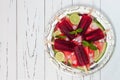 Watermelon mojito popsicles - ice pops - on slices of ripe juicy organic watermelon, served on vintage silver tray Royalty Free Stock Photo