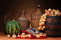 Watermelon, onion, wooden barrel and woolen bag