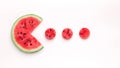 Watermelon Pacman eating small red round pieces