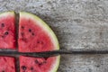 Watermelon pieces on the old board close up Royalty Free Stock Photo