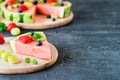 Watermelon pizza slice with fruits, dark background, copy space Royalty Free Stock Photo