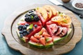 Watermelon pizza with various fruts